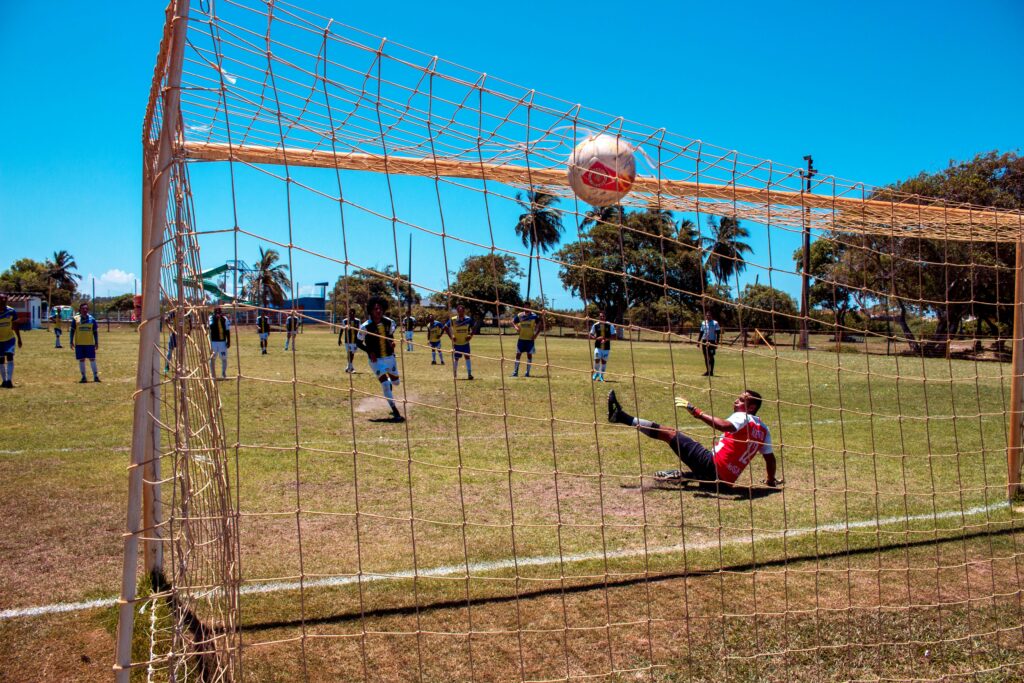 A photo of a player scoring a penalty kick.
