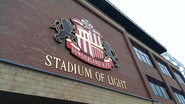 A photo of the Sunderland AFC badge on the side of their home ground, the Stadium of Light.